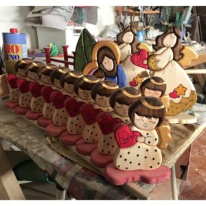 Un esercito di dolci angioletti per un battesimo in legno creazione artigianale