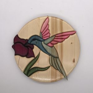 Colibrì colorato su fiore